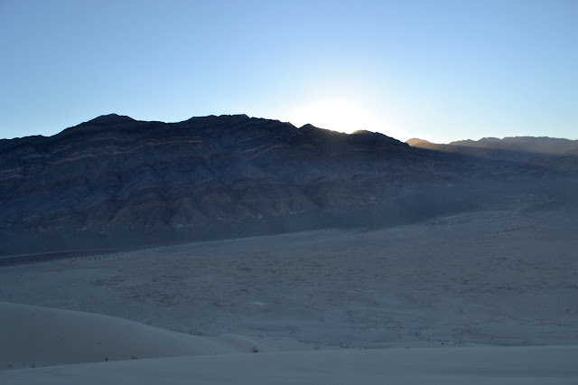 sun cresting above the mountains