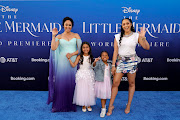 Tamera Mowry-Housley with her daughter Ariah Talea Housley, Cairo Tiahna Hardrict and Tia Mowry on the Little Mermaid blue carpet. 