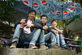 Three guys having drinks at Jingshan Park in Zhuhai