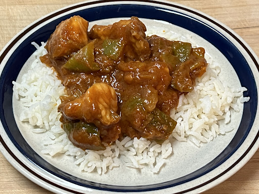 Savory catfish courtbouillon over freshly steamed Texmati rice.