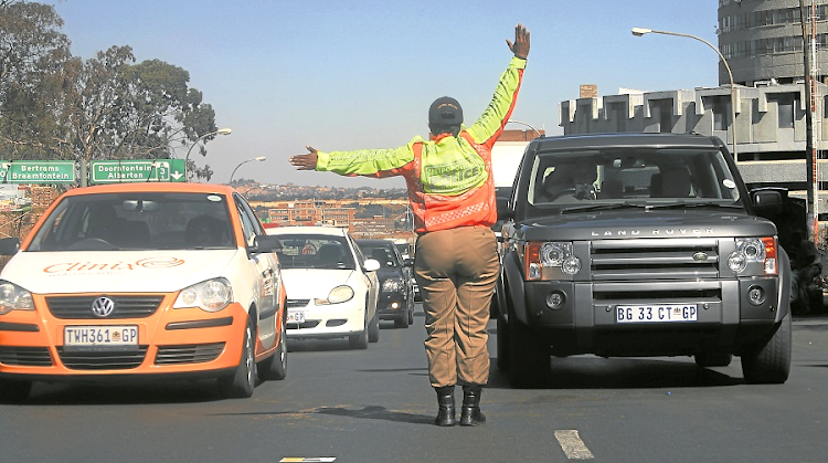 Traffic officials are the only ones allowed by law to control traffic snarl-ups. Picture: SUPPLIED