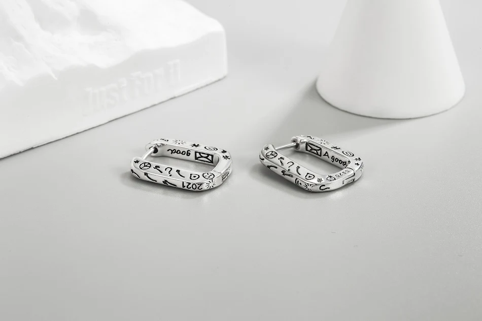 Women's Niche Design Oval Graffiti Earrings. Stand out with these unique earrings. Perfect for adding an artistic touch 