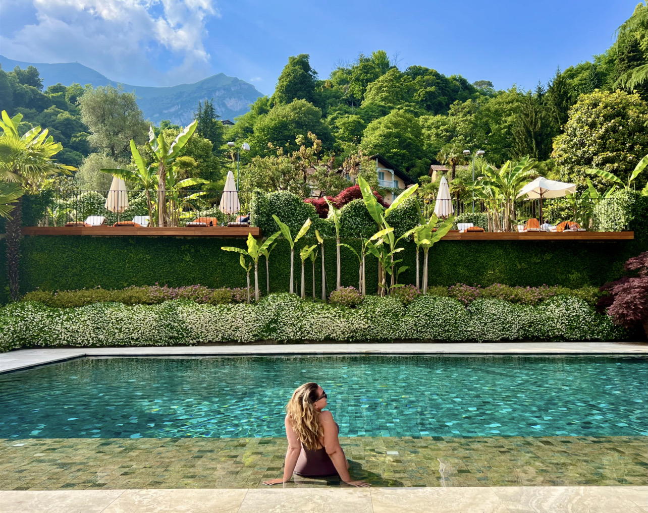 a woman sitting in a pool