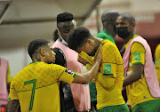 Keagan Dolly of SA consoles Rushine De Reuck after the Qatar 2022 FIFA World Cup qualifier between Ghana and South Africa. 