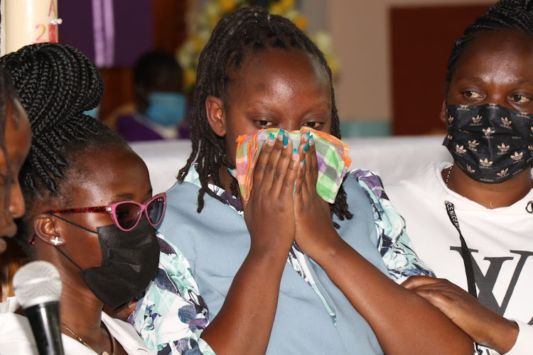 Gakara's first-born Agnes Njeri (centre) with her friends.