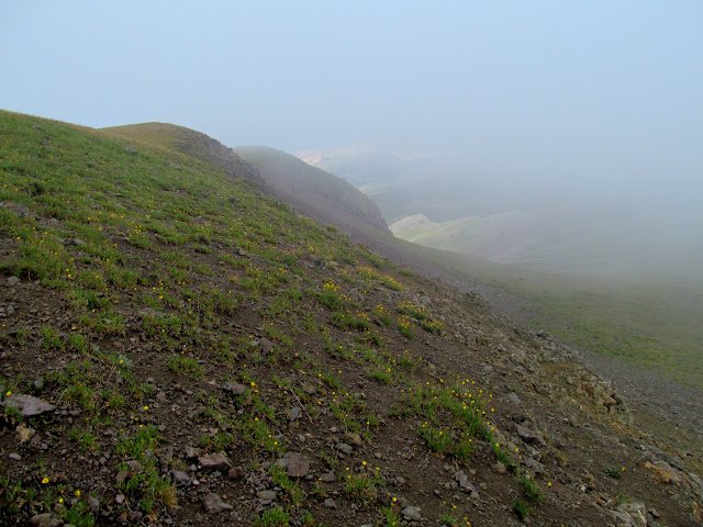 Clouds grazing the mountaintop