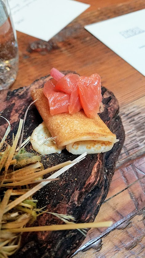 Fimbul Icelandic Dinner Spring 2018, Snacks Course of A board of Cod Cheek with fermented barley, dill mayo and mustard flowers; Pickled quail egg with smoked vinaigrette and ash roe dust; Dung smoked trout (using local dung from Sauvie Island and hay) with honey roasted radish, hay honey butter; Dulse bread