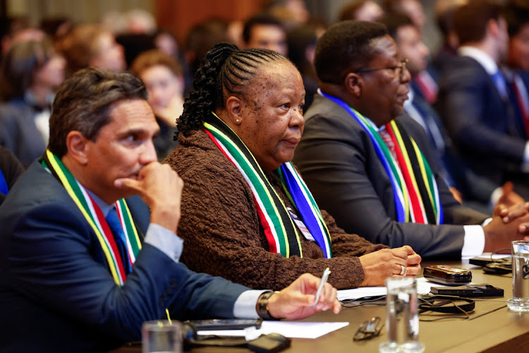 South Africa's department of international relations and co-operation director-general Zane Dangor, minister Naledi Pandor and South African ambassador to the Netherlands, Vusimuzi Madonsela, listen as the International Court of Justice (ICJ) rules in the case brought against Israel over its military operation in Gaza, in The Hague, Netherlands, on January 26, 2024.