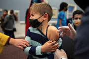 Levi Forst, 7, receives the Pfizer-BioNTech coronavirus disease (Covid-19) vaccine in Skippack, Pennsylvania, US, November 3, 2021. 