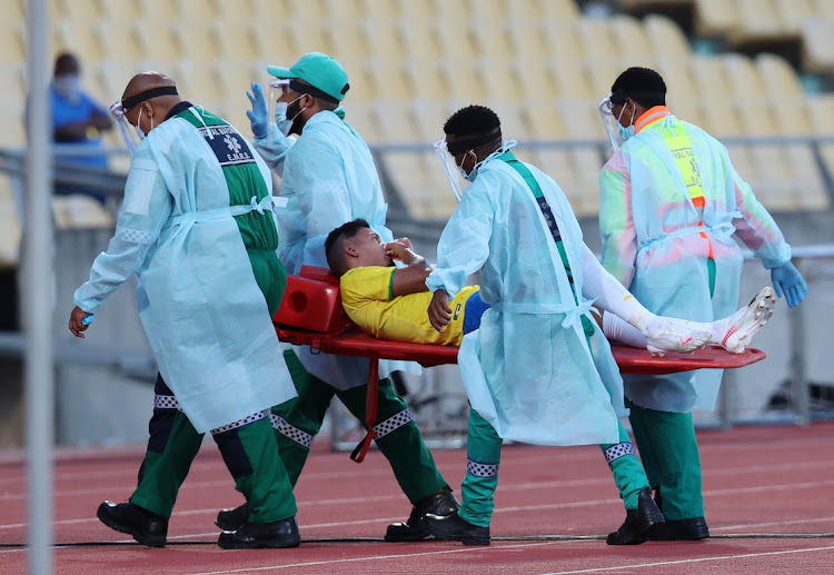 Gaston Sirino of Mamelodi Sundowns leaves the field after broken nose during the CAF Champions League 21/22 match between Mamelodi Sundowns and Al Hilal at Royal Bafokeng Stadium.