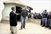 MOTHER AND GOLDEN GIRL: Caster and her mother Dorcas Semenya outside their rondavel during her welcoming home at Masethlong village, Moletjie in Limpopo, on Friday. Pic: ELIJAR MUSHIANA.  29/08/2009. © Sowetan.