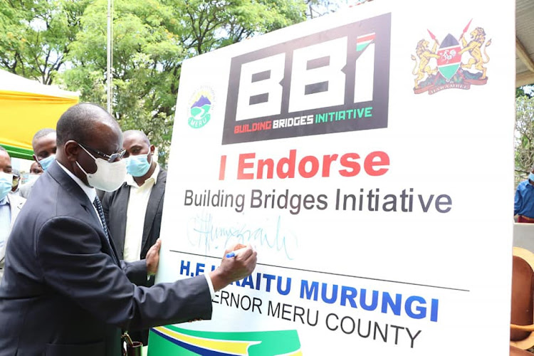 Meru Governor Kiraitu Murungi appends his BBI signature at Meru county commissioner's office last year