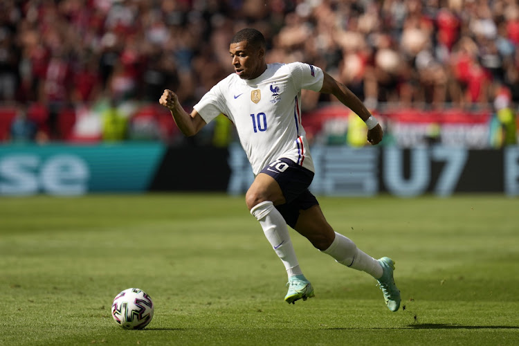 Kylian Mbappe of France runs with the ball during the Euro 2020 Championship Group F match against Hungary at Puskas Arena on June 19, 2021 in Budapest