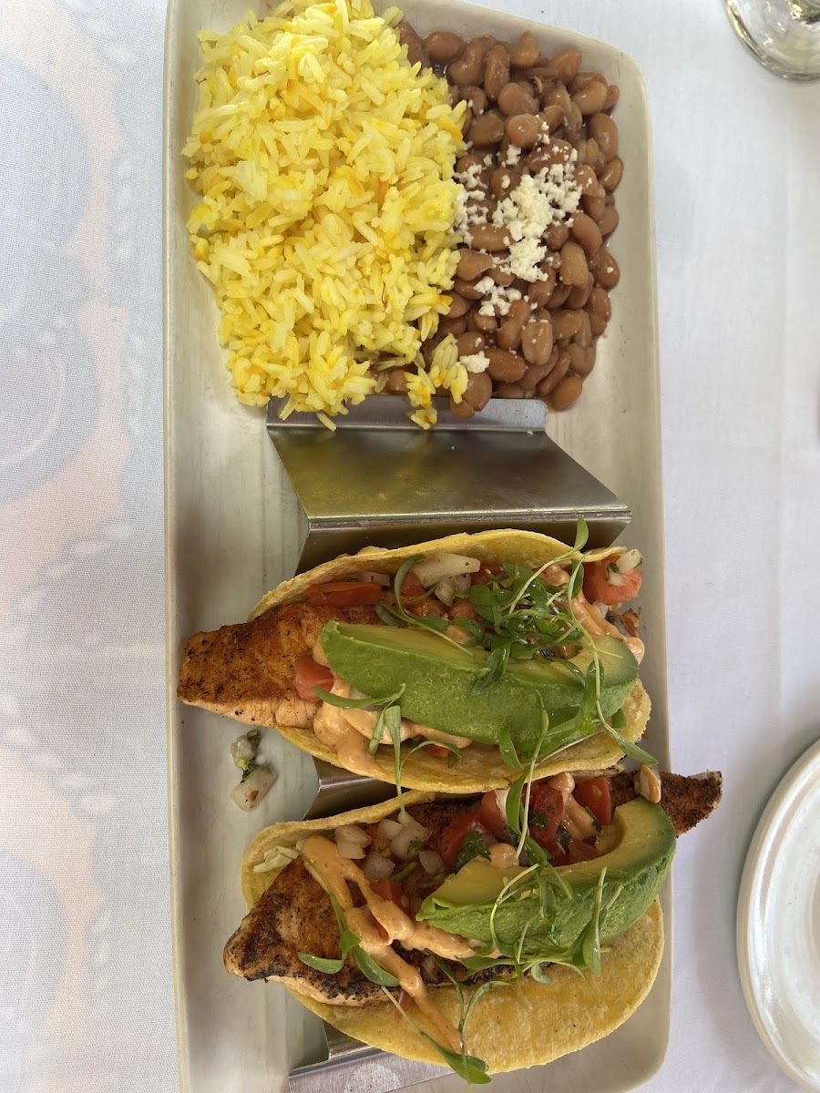 Fish tacos with pinto beans and saffron rice