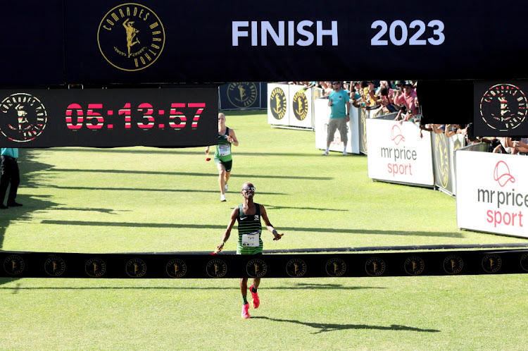 Tete Dijana crosses the line ahead of fast-finishing Pieter Wiersma to retain his Comrades Marathon crown on Sunday morning.