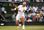 Rafael Nadal of Spain plays a backhand against Botic van de Zandschulp of Netherlands during their fourth round match at The Championships Wimbledon 2022 on July 4 2022.