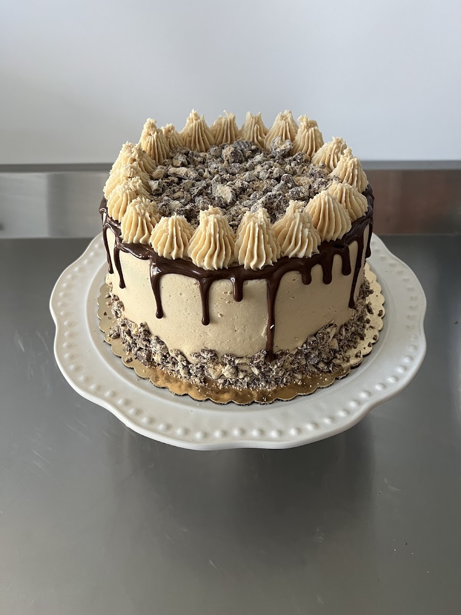 My most popular gluten free chocolate cake with peanut butter frosting and chopped Reese’s peanut butter cups.