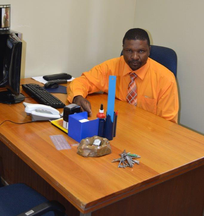 Former Dundee prosecutor Richard Sizwe Buthelezi seated inside his Dundee Magistrate's Court office where he raped a young woman in 2013.