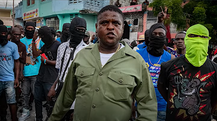 Ex-policeman Jimmy "Barbecue" Chérizier has warned the prime minister not to return to Haiti