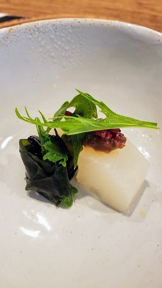 Nodoguro Twin Peaks themed dinner dish of Funeral Waldorf, Daikon soaked in rice water toped with aged miso, walnuts toasted in walnut oil, cherries, mizuno lovage, and wakame