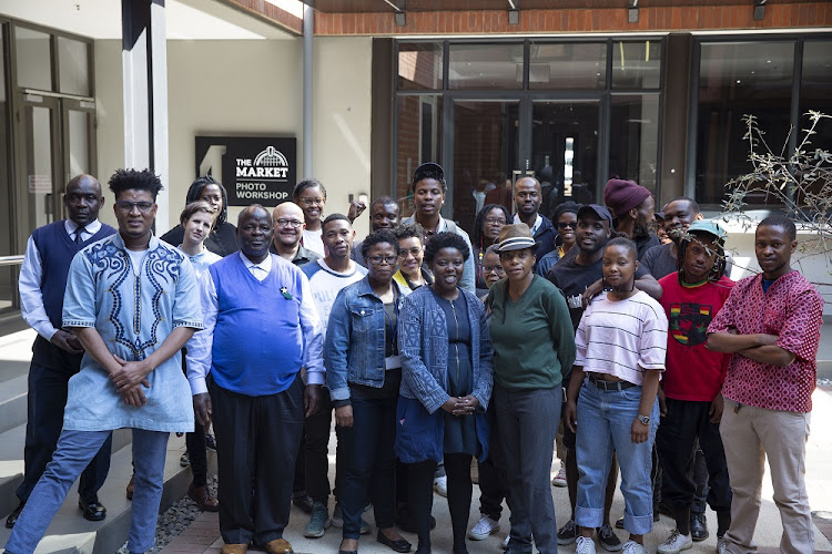 Some of the current photographers and staff of the Market Photo Workshop.