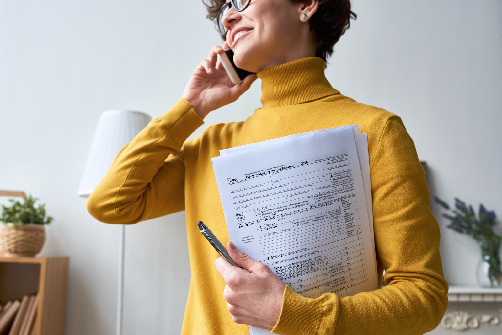 woman holding tax forms