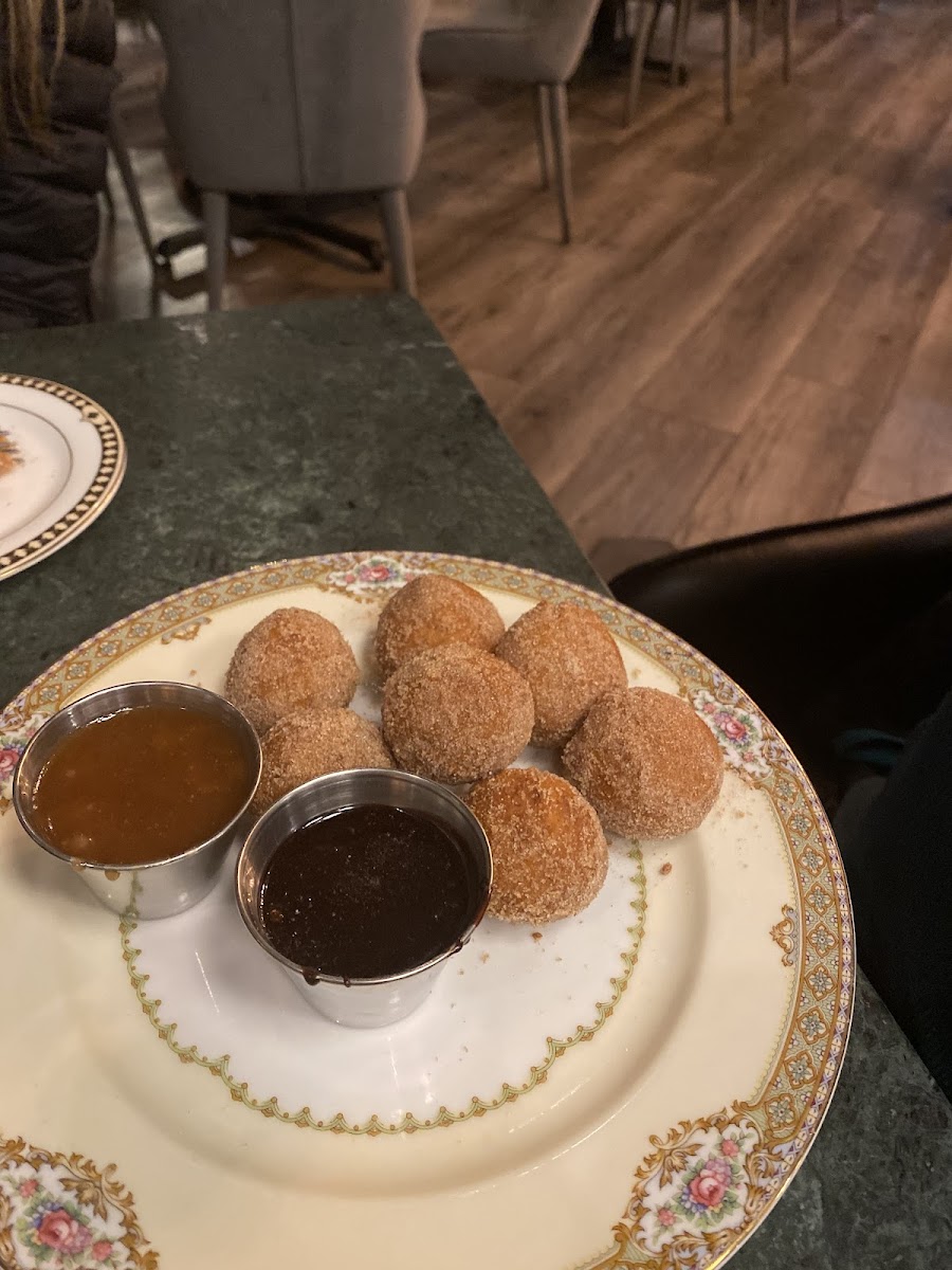 Cinnamon Sugar doughnuts with ricotta cheese inside with chocolate and caramel dipping sauces!