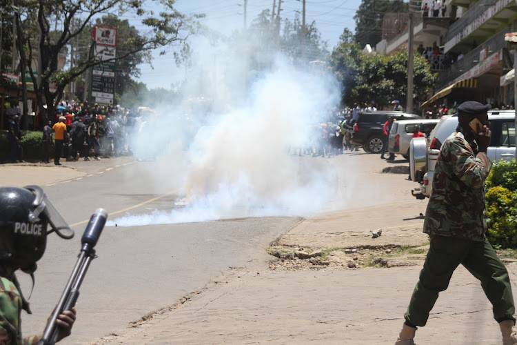 Police lob teargas canisters to disperse pro-Ruto protesters in Kabarnet, Baringo county on Thursday.