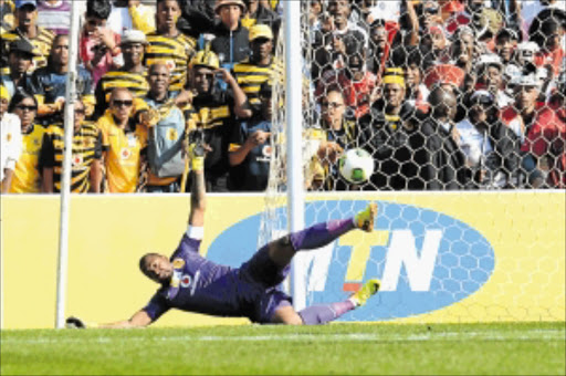 ALL IN VAIN: Itumeleng Khune makes a despairing dive to try to stop Daine Klate's free-kick in the first leg of the MTN8 semifinal match between Kaizer Chiefs and Orlando Pirates at FNB Stadium on Saturday Photo: Gallo Images