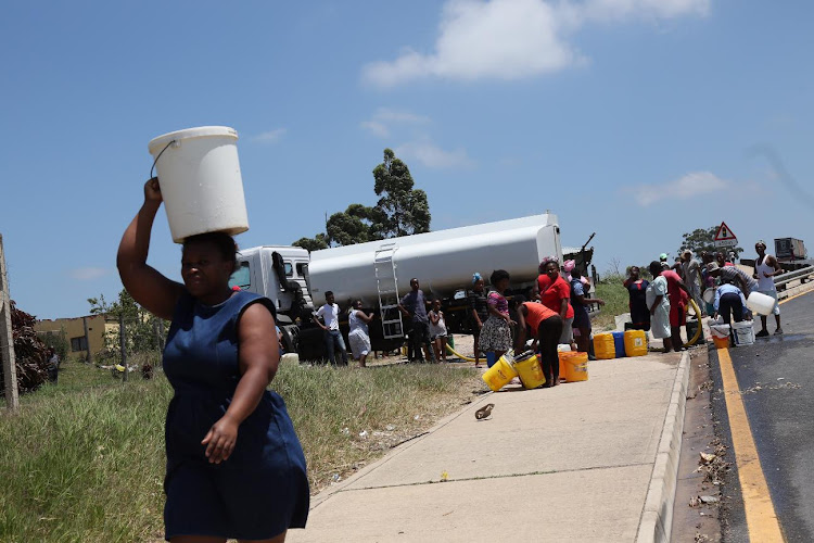 People fetch water from a tanker during a strike by SA Municipal Workers' Union members in Ugu municipality in November 2017. The area is still suffering water shortages and residents are fed up.