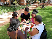 Students at the University of Johannesburg, Doornfontein campus, share a meal. They have complained that they have not received funds for meals and accommodation from NSFAS. 