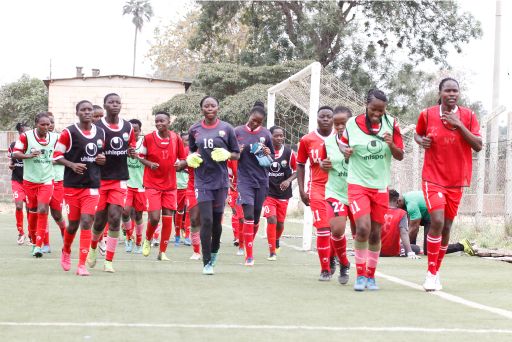 National women's football team players warm up during a training session at Camp Toyoyo grounds