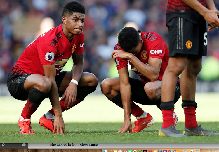 Manchester United's Marcus Rashford and Jesse Lingard look dejected after the match