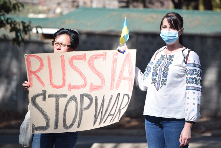 The protesters display their banners highlighting displeasure with the ongoing Russia- Ukraine war outside the Russian Embassy in Kenya on February 26, 2022.