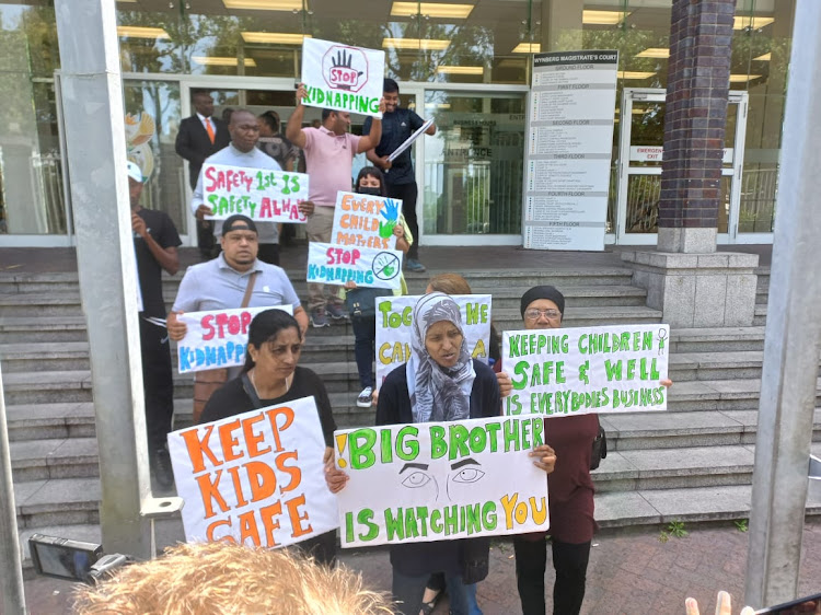 Gatesville community members protest outside the Wynberg magistrate's court on Thursday.