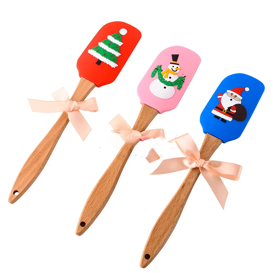 Spatule à beurre de Noël en silicone tridimensionnel pour pâtisserie festive et étaler facilement vos préparations.
