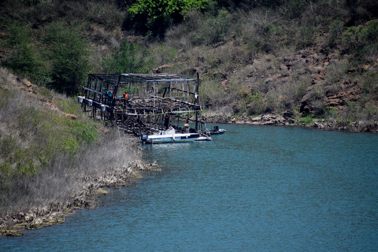 Inspectors from SA Maritime Association aboard the Shayamanzi on Lake Jozini. The luxury houseboat caught fire on the lake near Pongola on Saturday.