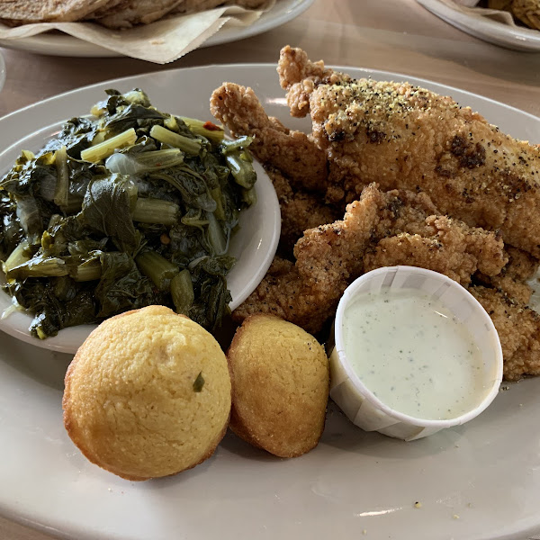 Adult Chicken Tenders fried southern style with lemon pepper seasonint, cornbread and turnip greens.