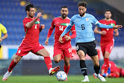 Shojae Khalilzadeh of Iran challenges Rodrigo Bentancur of Uruguay during the international friendly at NV Arena Sankt Poelten  Austria on September 23 2022.