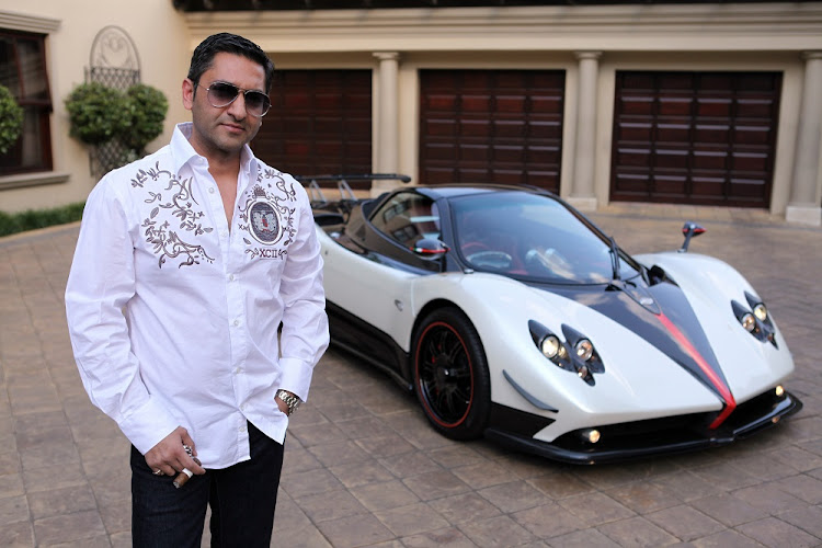 File image of controversial businessman Zunaid Moti at his home in Sandhurst, standing next to his Pagani Zonda limited edition.