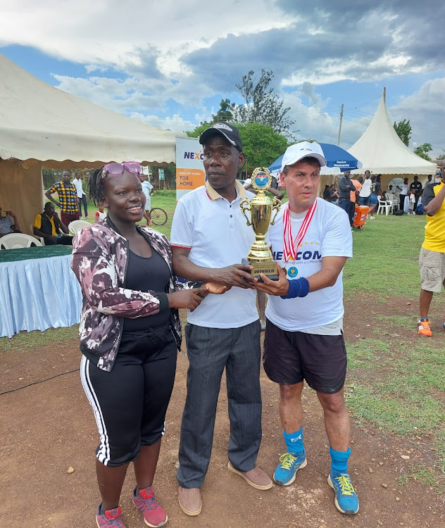 Nakuru Masters captain Andrew Jean Louis receiving the Masters trophy