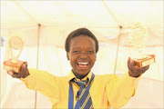 SMART STUFF: 
       Keletso Lebese  proudly shows off her  trophies. 
      
      
      
      PHOTO : ANTONIO MUCHAVE