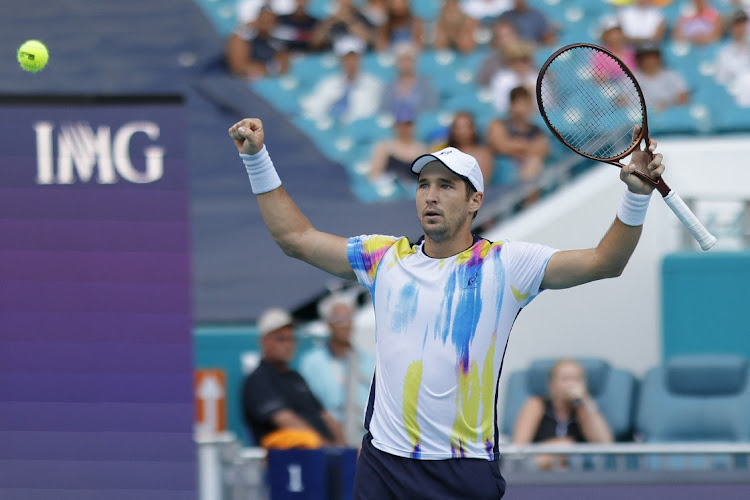 Serbia's Dusan Lajovic celebrates beating Great Britain's Andy Murray on day three of the Miami Open at Hard Rock Stadium on March 22, 2023