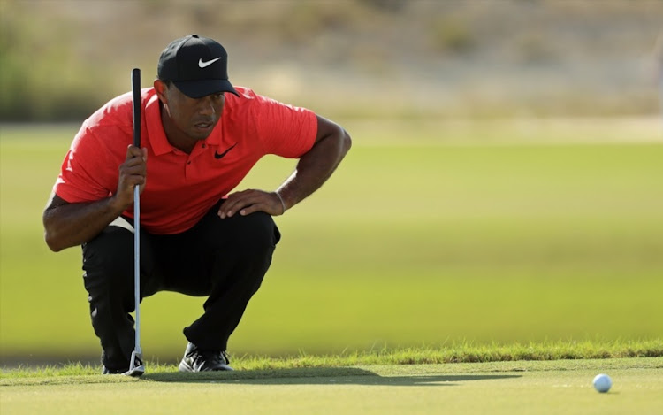 Tiger Woods of the United States lines up a putt on the 18th hole during the final round of the Hero World Challenge at Albany, Bahamas on December 3, 2017 in Nassau, Bahamas.