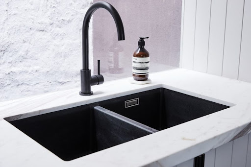 black kitchen sink with tap