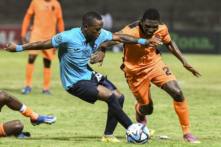 Moses Mthembu of Bay and Manuel Kambala of Polokwane fight for the ball on Saturday.