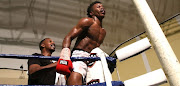 Xolani Mcotheli celebrates after defeating Flint Mdletshe at the Orient.