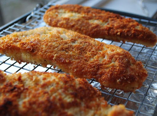 Using a rack over the foil-covered baking sheet allows extra fat to drip off the turkey cutlets and they turn out a bit crispier.