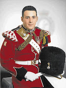 The soldier hacked to death has been named as Drummer Lee Rigby of 2nd Battalion, The Royal Regiment of Fusiliers. The musician was married with a two-year-old son and was a lifelong Manchester United fan