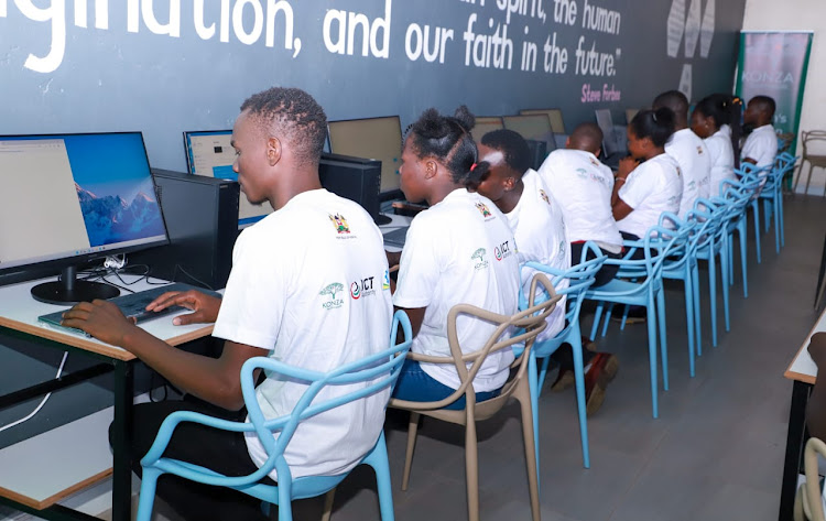 Youths working during the opening of the the Digital Hub in Bidii Ward, Kwanza Sub-County, Kitale, Trans Nzoia County on January 17, 2023.